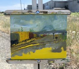 Impressionistic landscape painting of a Union Pacific rail yard with overhead wires and distant hills